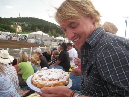 Pete and his funnel cake. A deep fried treat that tastes like donuts.